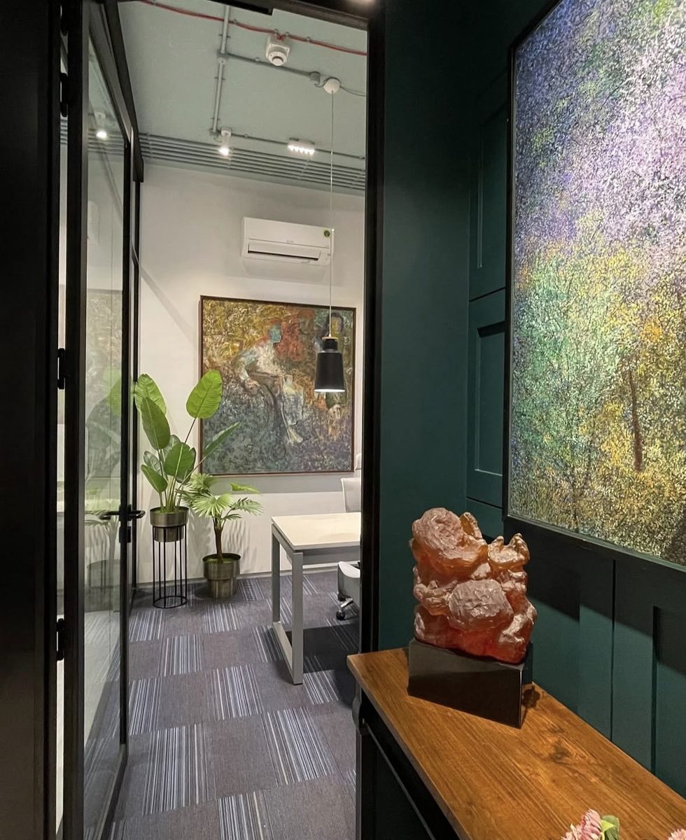 Chambers entrance: glass door, potted plants and a framed painting
